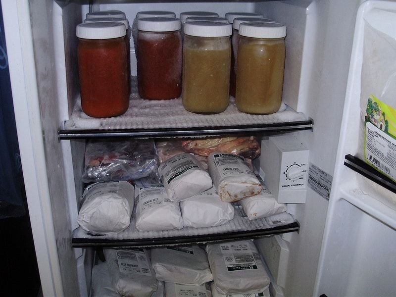 My freezer with crock pot spaghetti sauce, chicken broth, beef fat, pork fat and pastured meat.